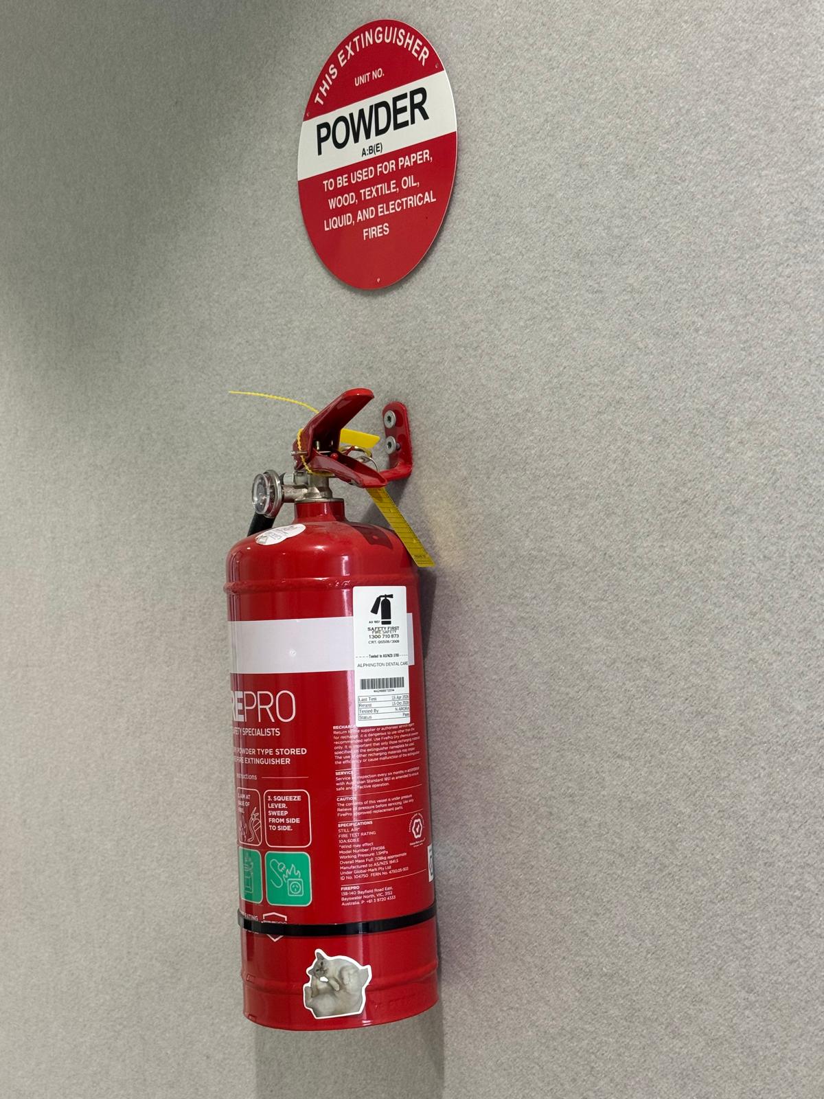 Certified safety technician inspecting commercial fire protection equipment
